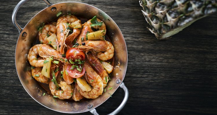 stir fry prawns in spicy asian food pineapple and herbs sauce