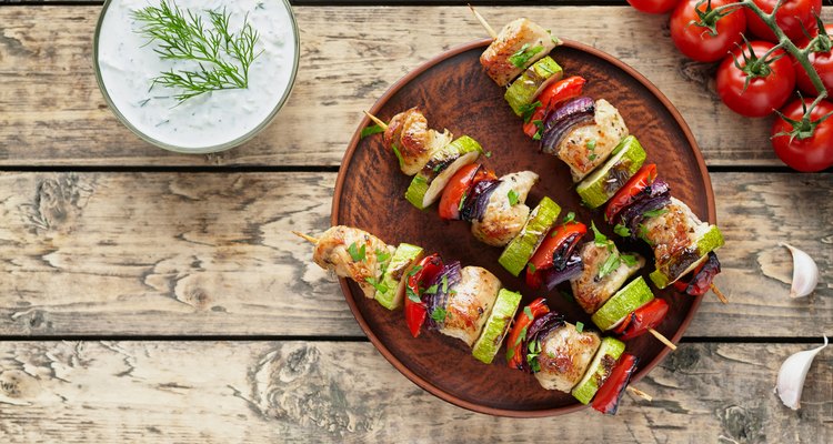 Grilled turkey or chicken meat shish kebab skewers with tzatziki