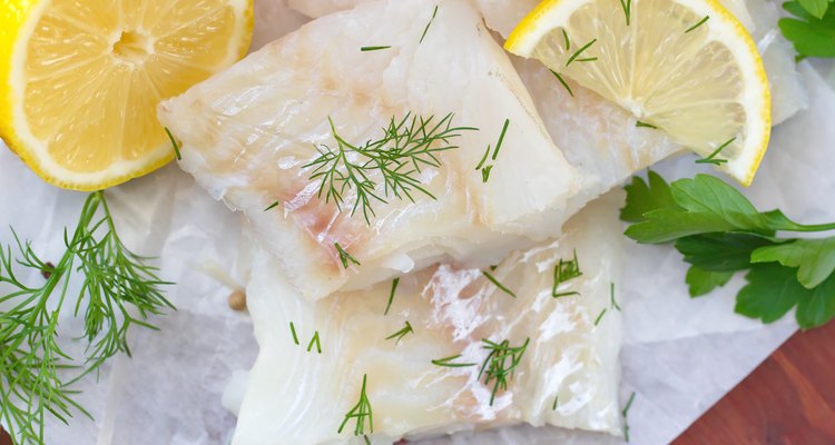 Raw fish with vegetables, lemon and seasonings