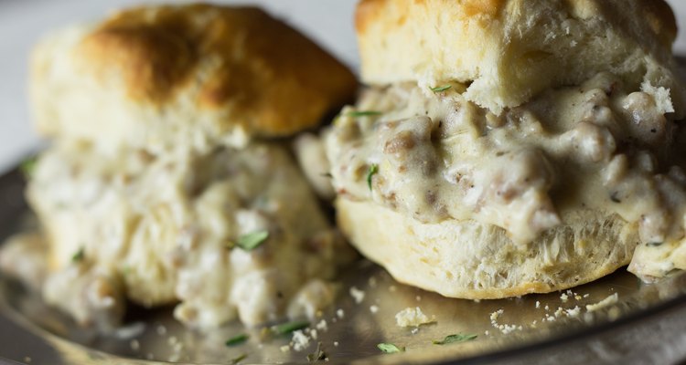 Homemade biscuits and sausage gravy on a silver platter