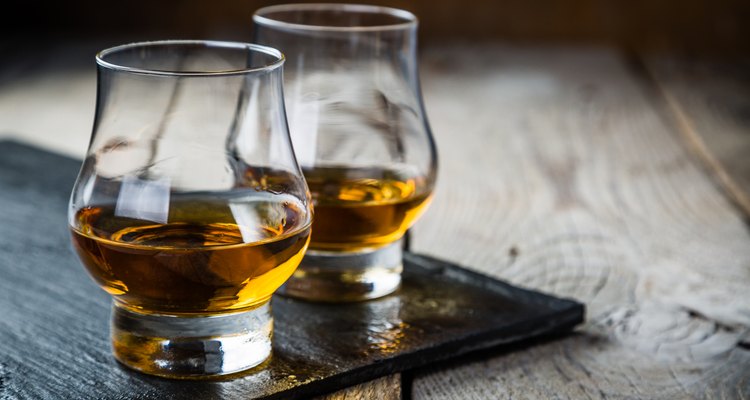 Whiskey with ice in glasses