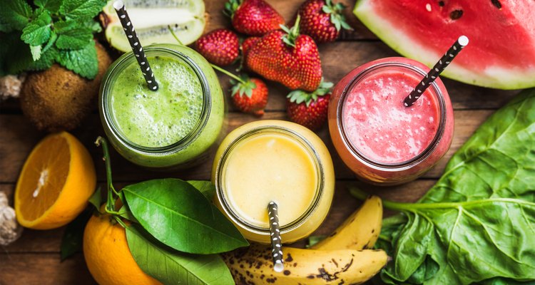 Freshly blended fruit smoothies of various colors and tastes