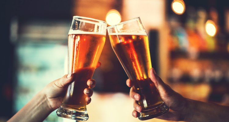 Two friends with glasses of beer. Shallow DOF