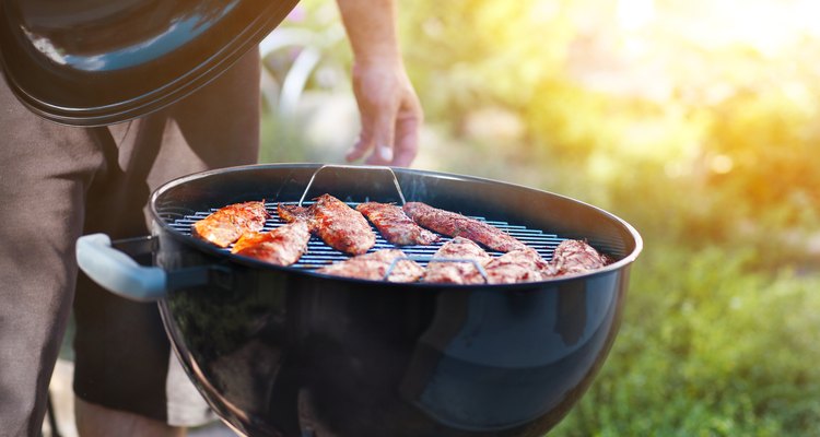 Fish fillets on the grill with flames