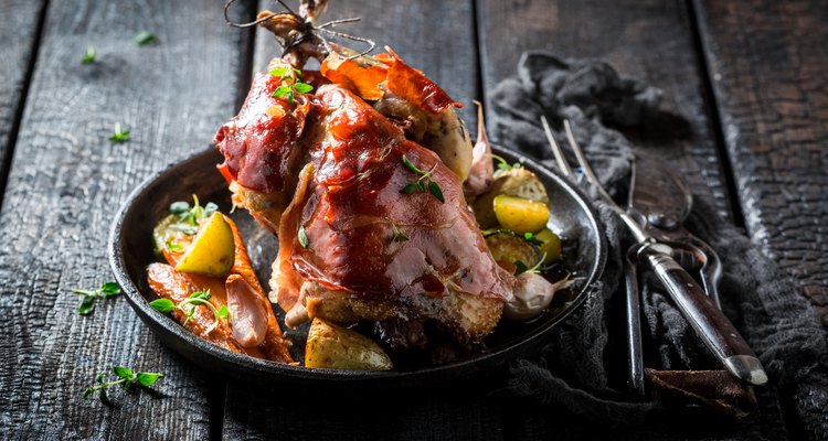 Grilled pheasant with bacon and spices and vegetables