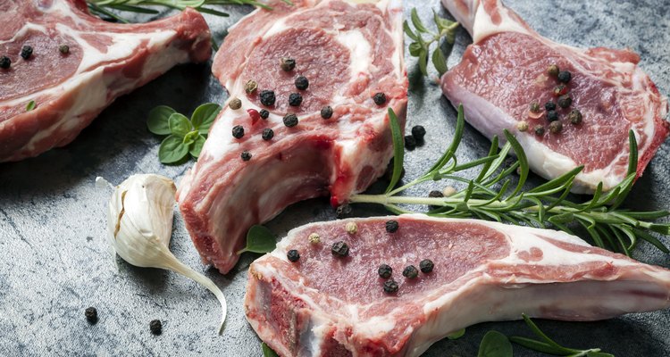 Raw Lamb Cutlets with Herbs on Slate