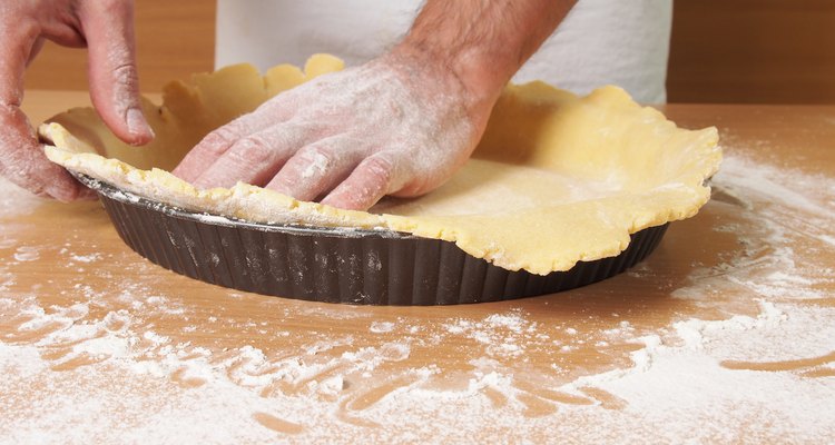 Press the pastry over the base and up the sides