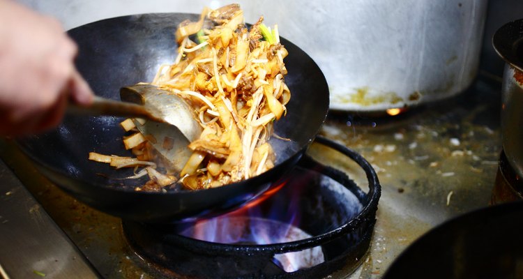 Preparing food in restaurant kitchen