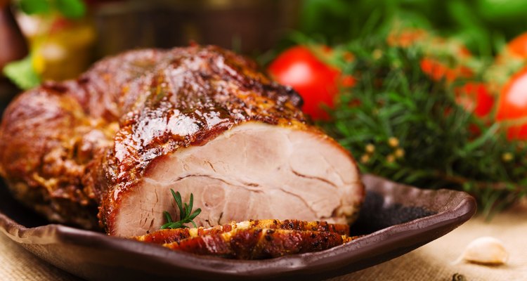 Roast pork with herbs and vegetables.