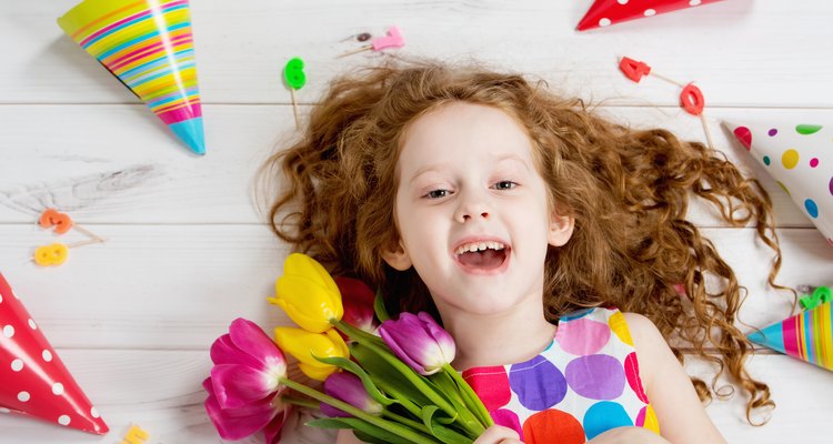 Happy laughing girl in birthday party.