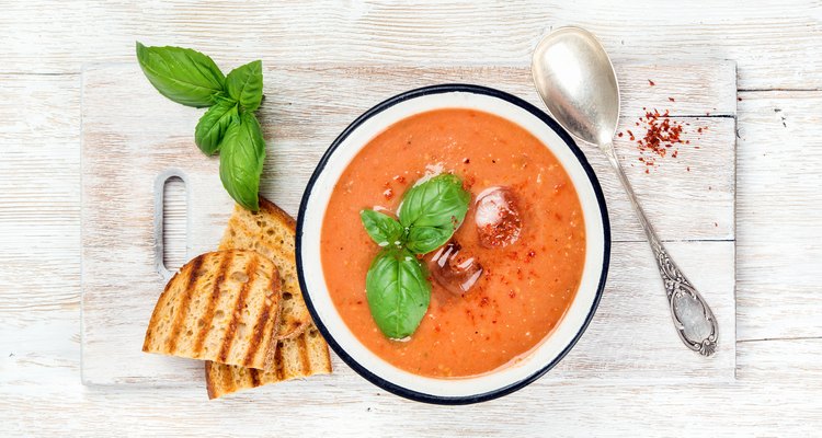 Tomato basil soup in a bowl with toast