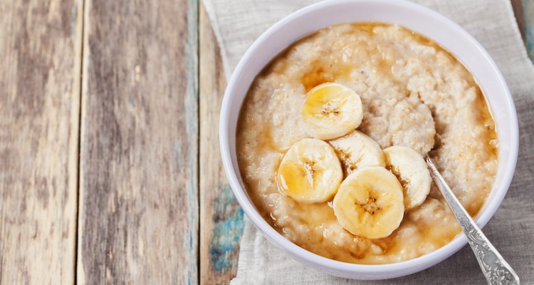 Healthy breakfast, oatmeal porridge with banana with text copy space