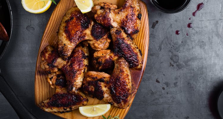 Roast chicken wings on cutting board