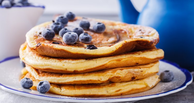 Pancake with banana , blueberries and honey.