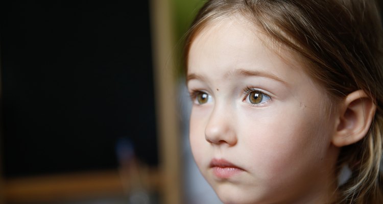 Thoughtful and sad little girl