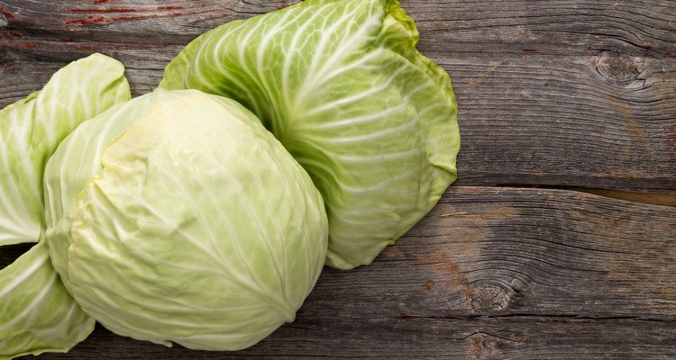 Fresh green cabbage on a wooden table