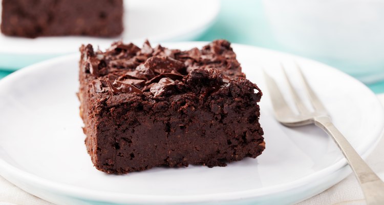 Homemade chocolate brownie on a plate with a fork