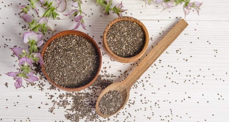 Chia seed healthy super food with flower over white