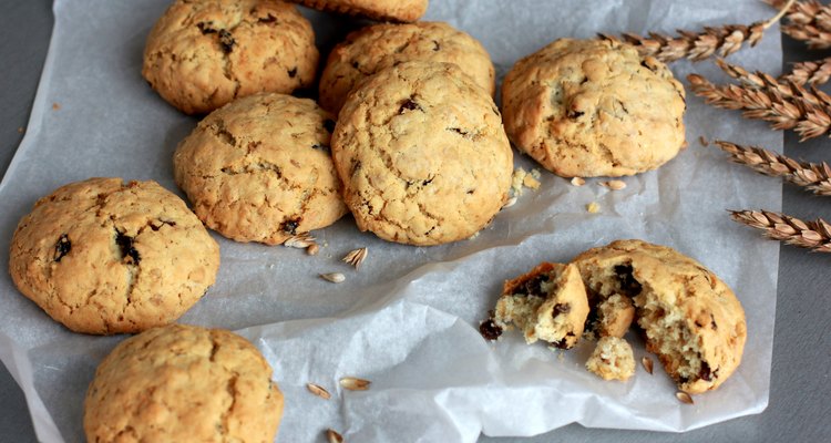 Oatmeal cookies and ears on the baking paper. Grey background