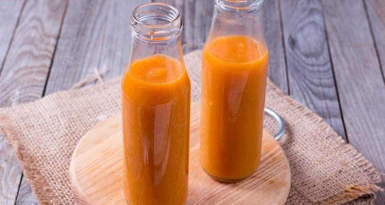 Juice bottle on wood background