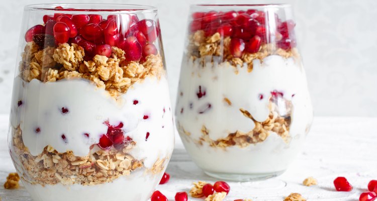 homemade yogurt parfait with granola and pomegranate fruit