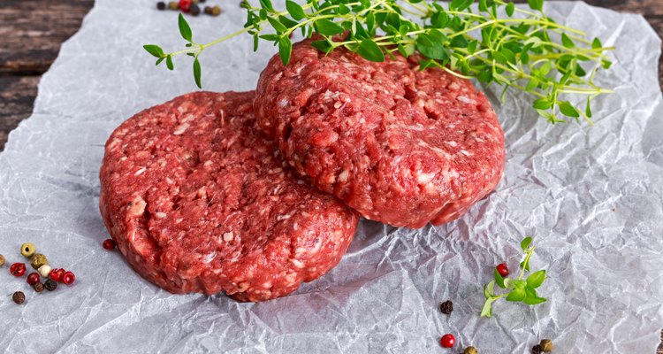 Home HandMade Raw Minced Beef steak burgers on scrumbled paper