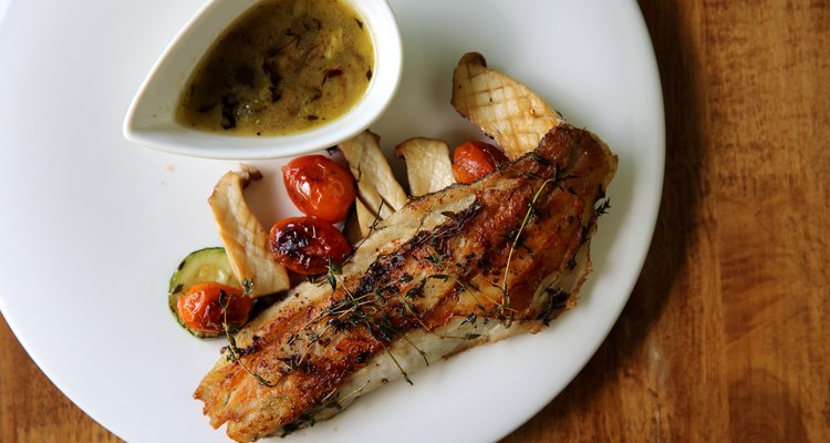 Sea bass fillet on wood background