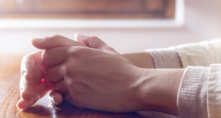 Close-up of woman hands in reflexive and concern position