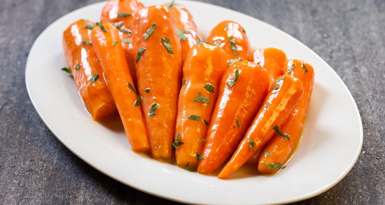 Honey glazed baby carrots with parsley.