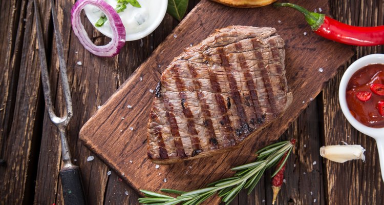 Beef steak on wooden table