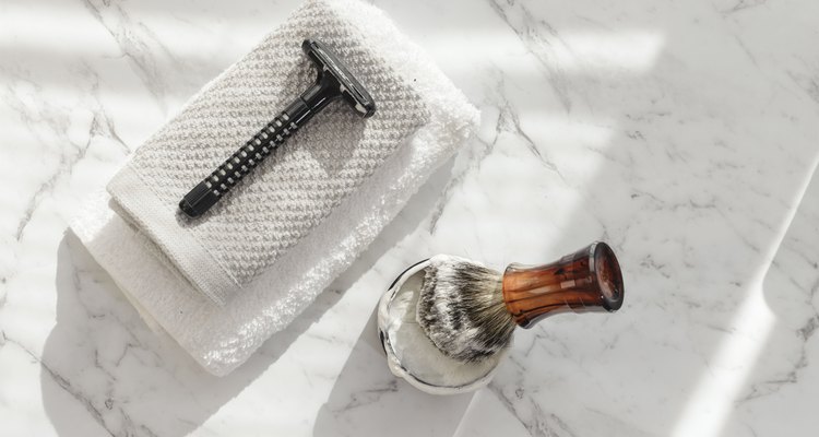 Directly Above Shot Of Shaving Brush And Razor On Marble Floor