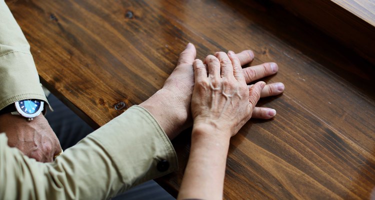 Elderly couple overlaying the hand