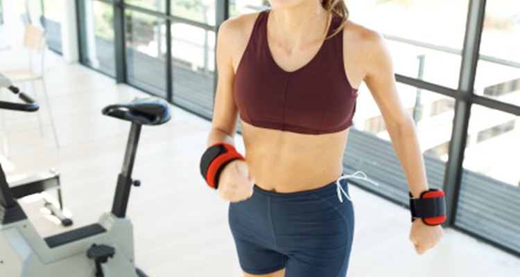 Wearing weights increases the work your body must perform during an activity.