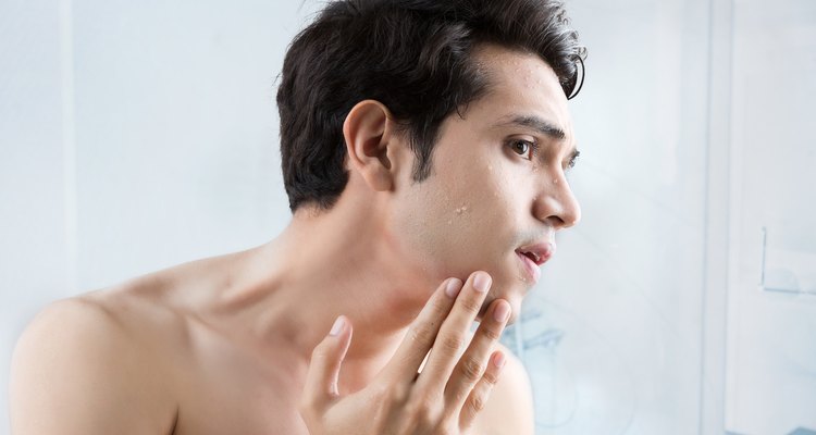 Man shaving in the bathroom.