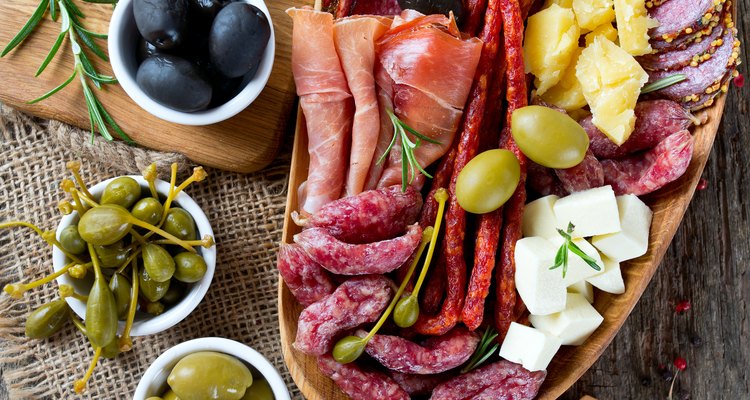Antipasti and catering platter with different meat and cheese products