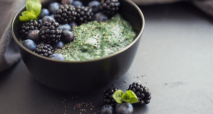 Healthy organic spirulina porridge topped with berries