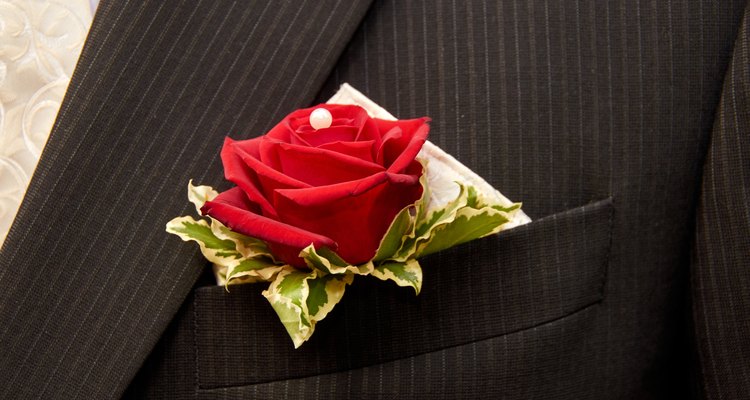 groom with buttonhole rose decoration