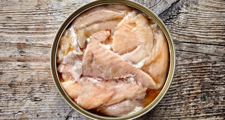Canned salmon on wood, from above