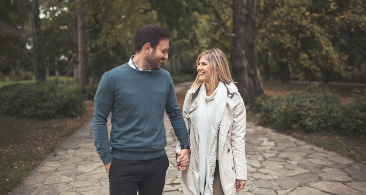 Happy couple walking in park