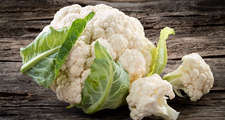 Organic cauliflower on wooden background