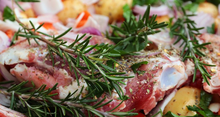 Goat meat with rosmary, garlic and vegetables ready for roasting