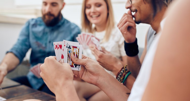 Group of friends playing card