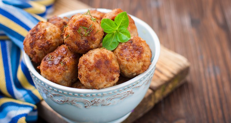 Turkey meatballs in a bowl on a wooden table