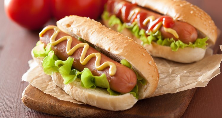 hot dog with ketchup mustard and lettuce