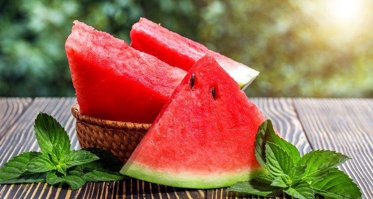 Fresh sliced watermelon wooden background