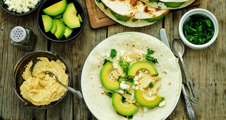 tortilla with hummus, avocado, feta and parsley