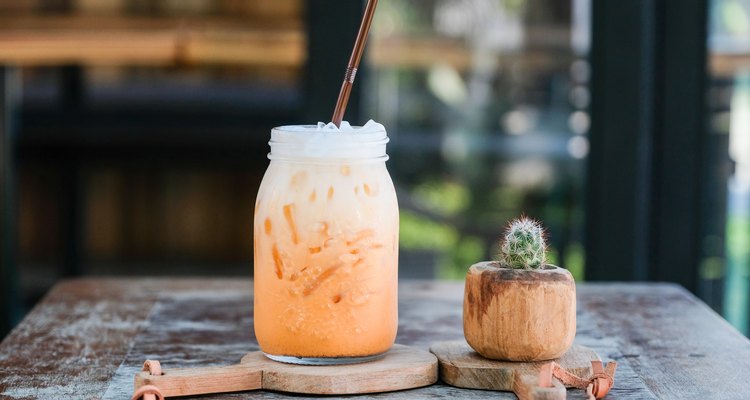 Iced Thai tea with milk smoothies on wood table