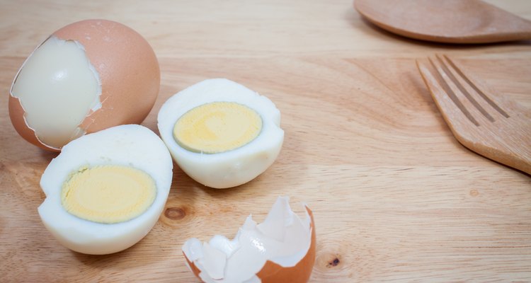 Boiled eggs on wooden background