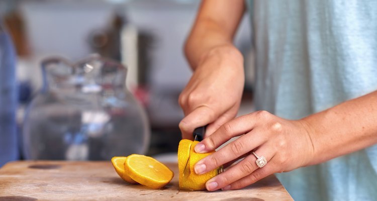 woman cutting lemon
