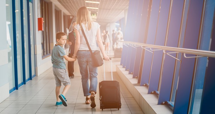 Woman and her child passing through the airport